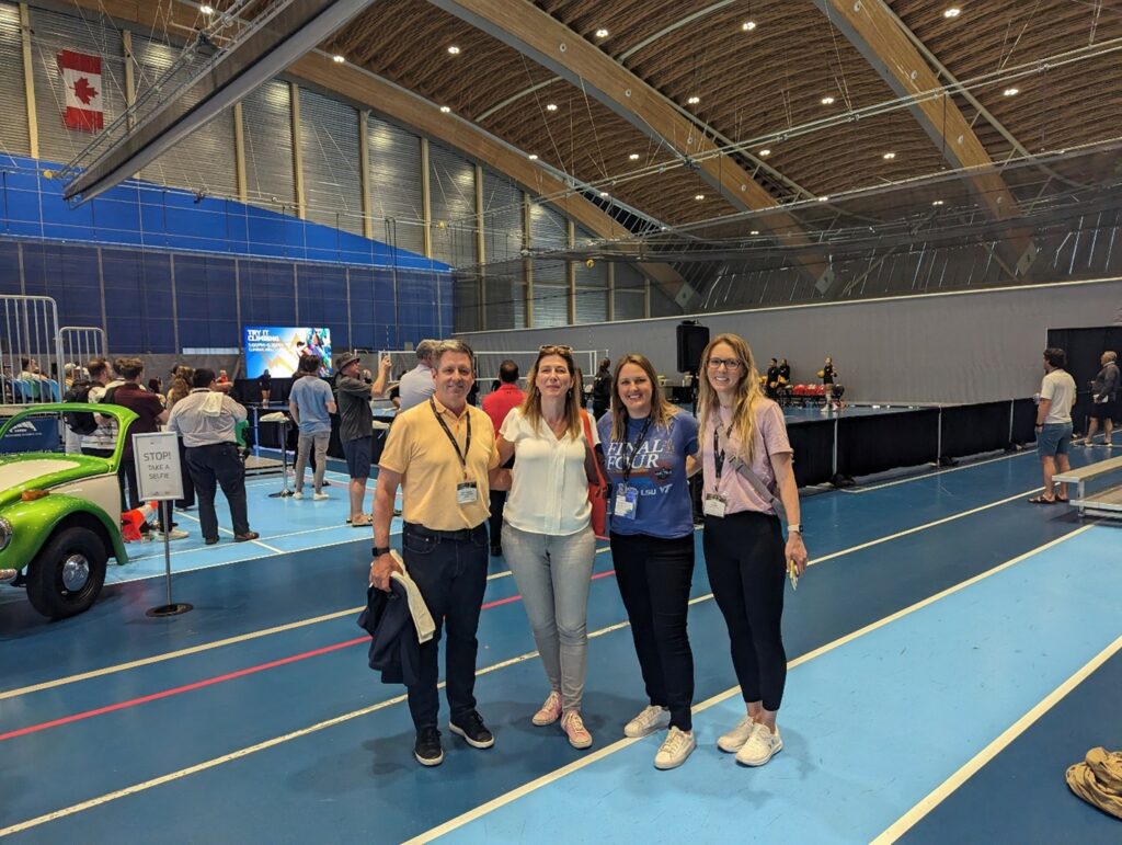 Caption: Grant MacDonald, Sheena McCrate, Jennifer Stoll, and Pam LaCroix taking in a Volleyball Canada Next Gen exhibition game at the Olympic Oval.
